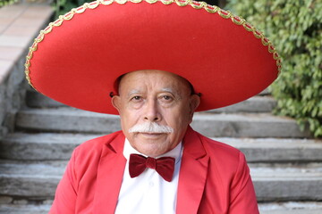 Senior mariachi singer with a mustache