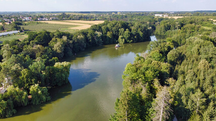 Fototapeta na wymiar View of the pond and trees on the shore at Arboretum Sofiyivka. Uman. Ukraine. Europe