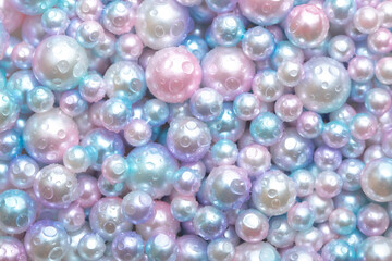 Beautiful background with pearl pearls, top view. Abstract texture for festive backgrounds. Shiny...