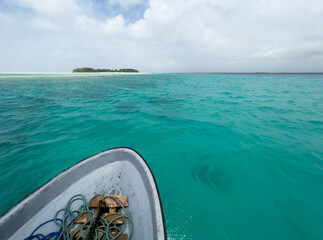 Shallow atoll turquoise waves around Mnemba island in the Indian ocean near the Zanzibar island,...
