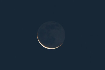 Waning crescent, Moon's grey light on the morning sky
