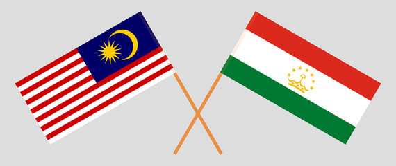 Crossed flags of Malaysia and Tajikistan. Official colors. Correct proportion