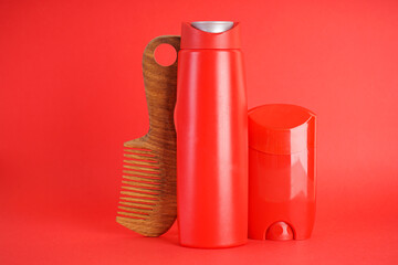 Set of different men's cosmetic products on red background.