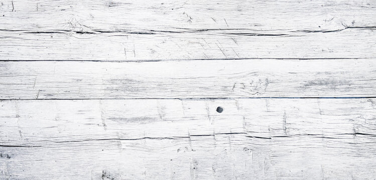 White painted chipped wood texture with flat wooden boards background
