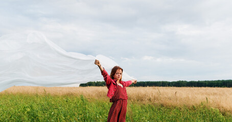 Image of a young girl on the background of a country landscape