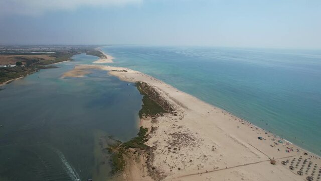 Aerial view of Praia da Fabrica, also known as Praia de Cacela Velha beach, a sandy barrier island at the mouth of the Ria Formosa in the Algarve region of mainland Portugal