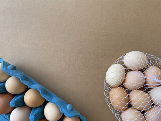 Overhead view of free-range organic chicken brown eggs in blue tray. Background with chicken eggs. Eggs for Easter. Background for cafes, restaurants, fast food outlet. Craft background.
