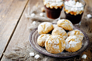 Pumpkin cookies with cups of coffee