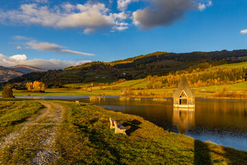 Fototapeta na wymiar autumn pond under the mountains, Murau district,.Styria, Austria