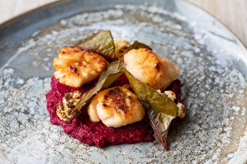 Pan fried scallops with beetroot puree and cauliflower