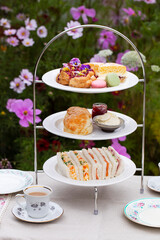 Afternoon tea with cakes, scones and sandwiches