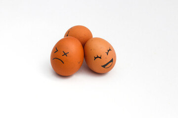 a Group of brown chicken eggs with happy, annoyed, and tired faces isolated on white background.