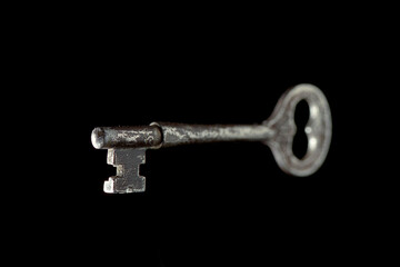 Skeleton key antique, selective focus, isolated on black