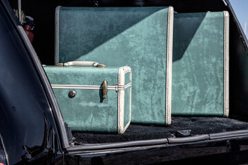 Old Luggage in the trunk of a vintage car at Wheels on the Waterfront car show