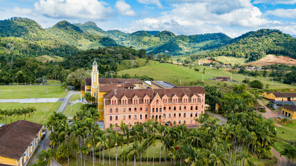 Fototapeta na wymiar Mosteiro de Corupá, SC - Beautiful architecture of the monastery with the surrounding nature and mountains in the background