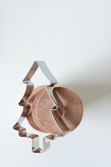 hanger rings and christmas cookie cutter on a white background