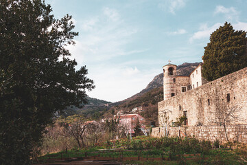 Fototapeta premium Garden beds next to the walls of the monastery