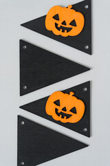 blank tags and halloween pumpkins on gray paper