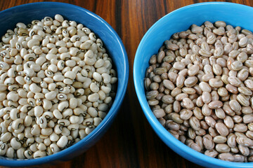 Assorted beans. Carioca beans, black eyed beans. Beans bowl on wooden background.