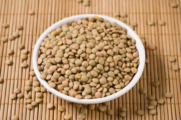 raw lentil culinaris beans on wooden background