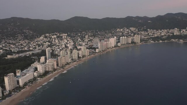 Birds eye view dolly in of beautiful Condesa beach seaside city at day