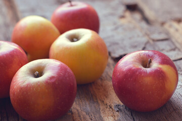 Red-yellow apples  on a wooden background.