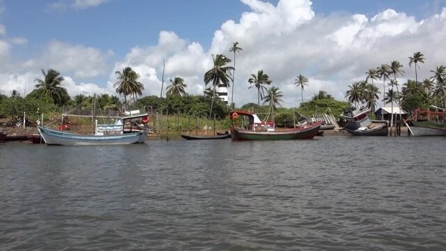 Mandacaru lighthouse and wooden fish boats in the small village in Barreirinhas, Maranhao, Brazil
