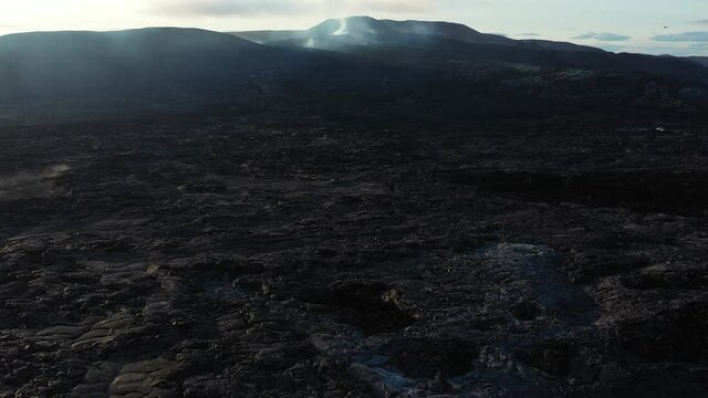 Aerial view over Smokey Dormant volcano at sunset, Mount Fagradalsfjall
4K drone shot of smoke Rising out of Mount Fagradalsfjall crater, September 2021, Iceland 
