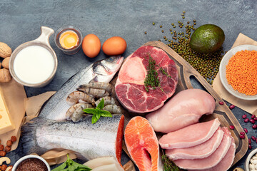Natural sources of protein on dark background.