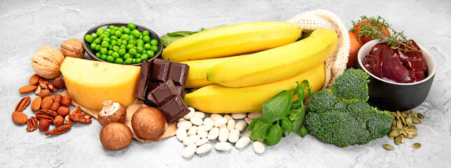 Food high in vitamin B7 on dark background.