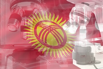 Fototapeta premium Microscope on Kyrgyzstan flag - science development conceptual background. Research in healthcare or clinical medicine, 3D illustration of object