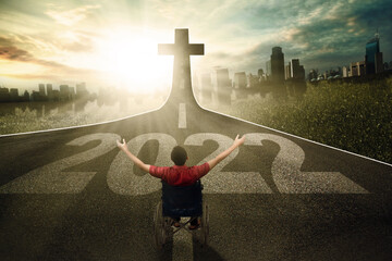 Disabled man with 2022 numbers and Cross symbol