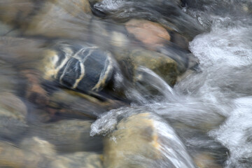 A tributary to the Savage River flows over colorful rocks in Denali National Park and Preserve.