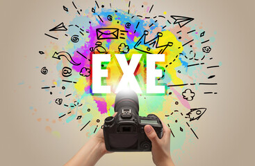 Close-up of a hand holding digital camera with abstract drawing