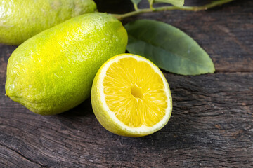 Fresh lemon on an old wooden table.
