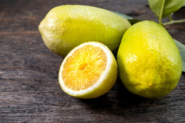 Fresh lemon on an old wooden table.