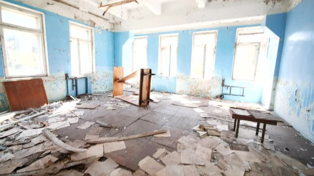 Dusty classified papers, documents scattered on floor, abandoned Soviet Chernobyl Pripyat building