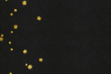 Golden leaves on black washi paper background image
