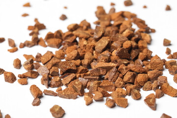Pile of chicory granules on white background, closeup
