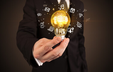 Businessman holding a light bulb, social media concept concept