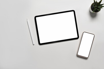 Fototapeta na wymiar Mock up digital tablet and smart phone with blank screen on white background.