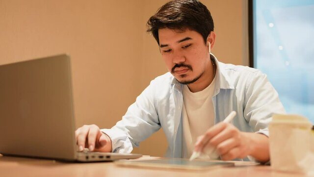 slow motion scene illustrator middle eastern man hand use stylus pencil to create or draw about artwork on digital tablet in office for creative occupation concept