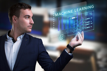 Business, Technology, Internet and network concept. Young businessman working on a virtual screen of the future and sees the inscription: Machine learning