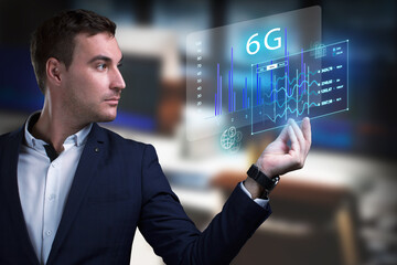 Business, Technology, Internet and network concept. Young businessman working on a virtual screen of the future and sees the inscription: 6G