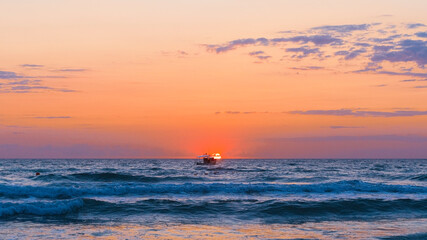 Sunset boat orange sea sun. High quality photo