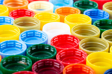 Plastic bottle caps background. Cap material is recyclable.