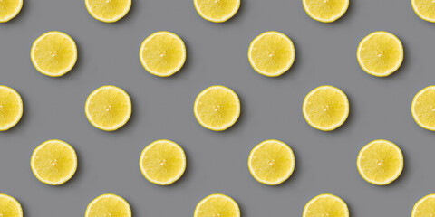 Yellow lemons on gray background seamless endless pattern. Colors of the Year 2021 Illuminating and Ultimate gray
