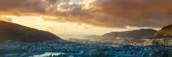 Aerial and panorama view Bergen. Beautiful sky over Bergen in Norway. Beauty of Vestland. Dramatic weather Norway in sunset late evening.