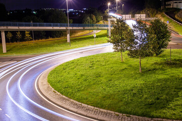 Roundabout in Bergen Norway at night. Light trail from cars.