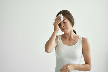 woman with headache holding headscarf on the corner migraine